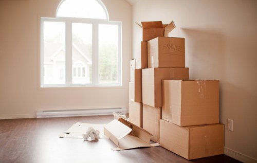Packed household items being loaded into a removals van