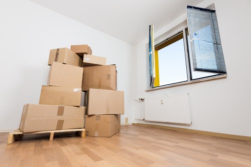 Movers carrying furniture through a Richmond upon Thames property