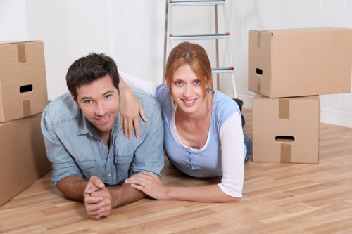 Professional movers handling furniture in a Richmond upon Thames property