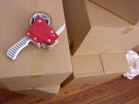 Unpacking boxes in a Richmond upon Thames property after a move