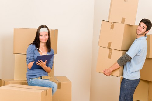 Business relocation team loading office furniture carefully for a move in Richmond upon Thames